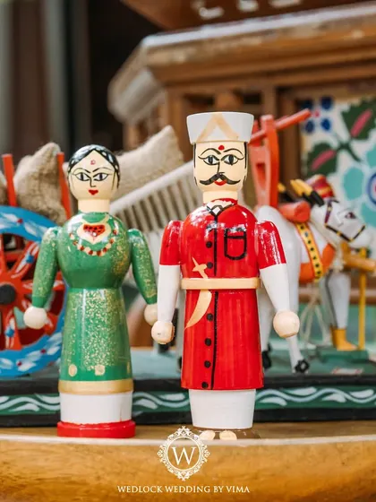 A close-up of a traditional Channapatna toy, used as a unique decor element for a carnival-themed Mehendi. We love incorporating local crafts to add a special, authentic touch.