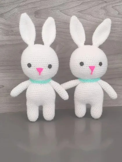 A pair of sweet white bunnies. They are simple, classic, and very soft to the touch.
