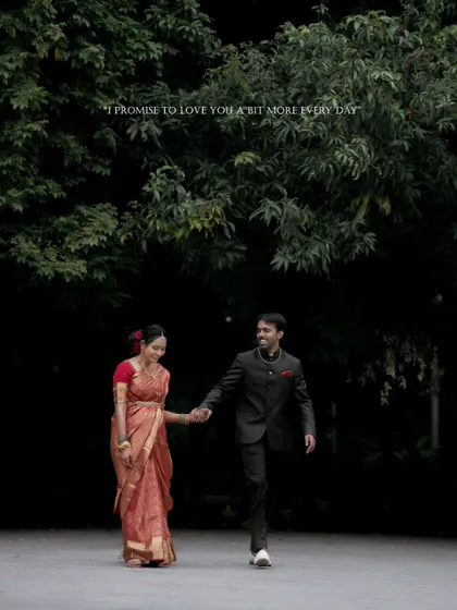 A promise to love each other a bit more every day. This romantic shot captures the couple walking hand-in-hand after their wedding ceremony.