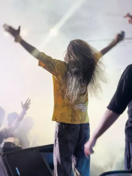A moment of pure energy, with my hair flying as I move to the beat on stage.