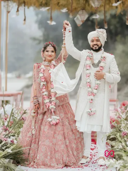 A joyous portrait of the couple after their Varmala, celebrating their union at their beautiful destination wedding.