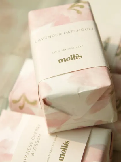 A close-up of the Lavender Patchouli soap from the baby announcement order, showing the beautiful custom packaging.