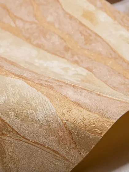 This textured wallpaper in warm, earthy tones offers a blend of exquisite design and high-quality material. It's backed by my 3-year peel-off warranty, ensuring your walls look great for years.