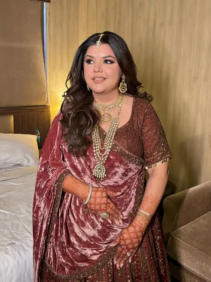 Another shot of Tisha's burgundy glam. The warm, deep tones are perfect for an evening winter wedding event.