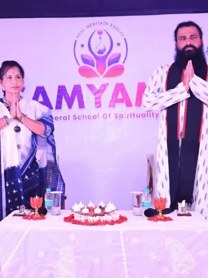 We stand in a gesture of 'Namaste' at an event. This image, a duplicate of ID 73 from the In-Person cluster, represents our overall mission as a Liberal School of Spirituality.