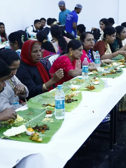 Guests from diverse backgrounds coming together to enjoy our traditional South Indian vegetarian feast.