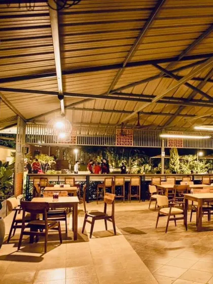 A view of our main dining and bar area at night. It's a central hub of activity where teams can eat, drink, and socialize.