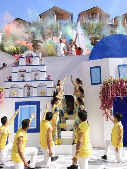 From a burst of colors in Greece to time travel in Paris. This 'Around the World' carnival entry was a dream, telling the couple's story through different themed zones.