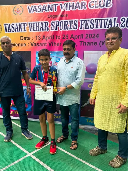 Viaan Jadhav, our Boys U-13 winner, proudly receives his trophy. His hard work and training have clearly paid off.