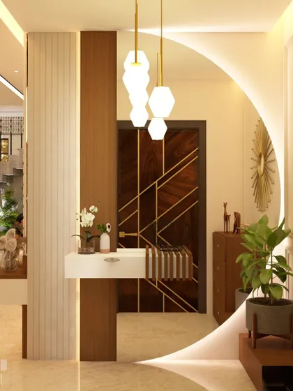 This foyer design features a striking circular mirror as a central element, creating an illusion of a larger space. The combination of wood paneling, a floating console, and pendant lighting results in a welcoming and stylish first impression.