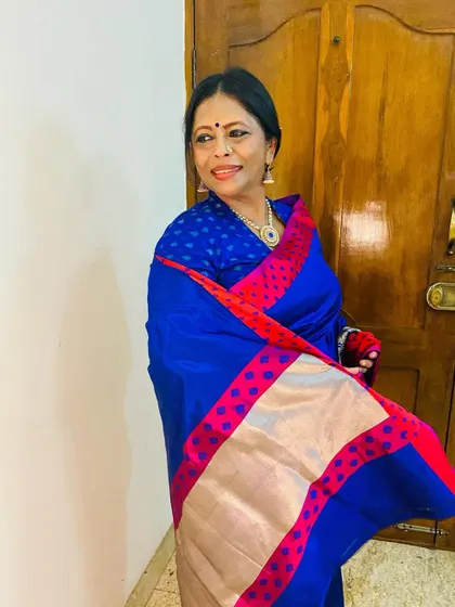 A candid moment in my royal blue Banarasi for Navratri. This color always feels so rich and serene.