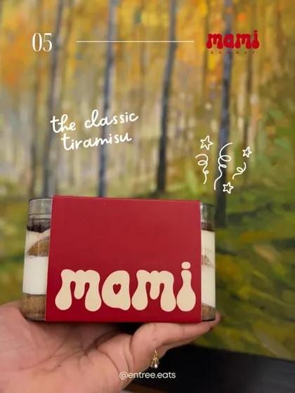 The classic tiramisu from Mami Bombay, presented in its branded packaging. This shot is great for showcasing desserts from home bakers and delivery kitchens.