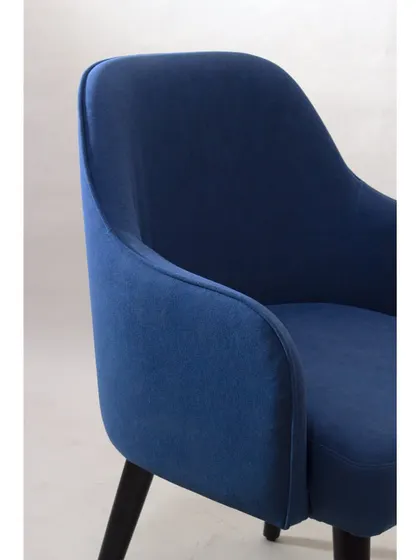 A close-up of the armchair's upholstery, highlighting the soft fabric and the clean, curved lines of the design.