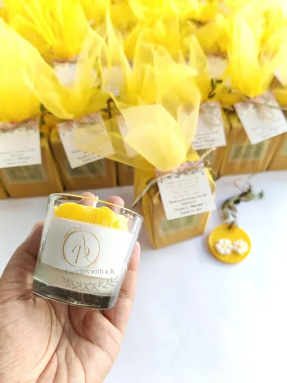 A large order of 200 mini gift boxes for Prachi's Haldi ceremony, including yellow peony candles and matching wax sachets.