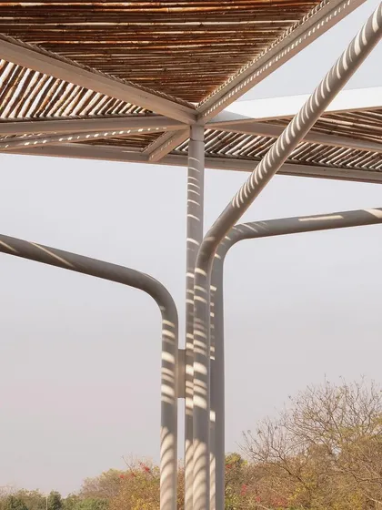 (Duplicate of 24) The curved steel supports for the bamboo canopy were designed to feel like the branches of a tree, adding an organic element to the structure.