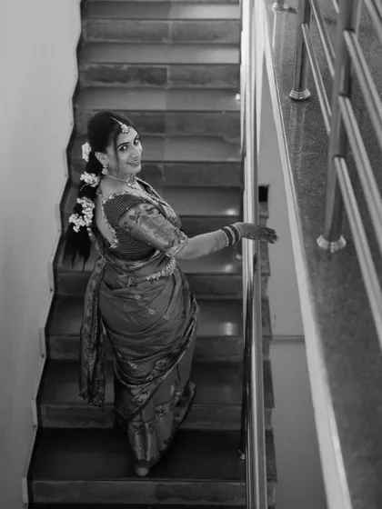 A creative black and white portrait of the bride, her face partially obscured, creating an artistic and moody feel.