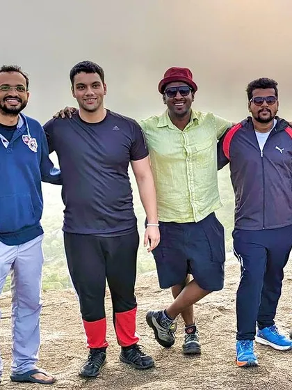 A group of friends posing on a trail. These are the memories from our last weekend treks, filled with laughter and beautiful scenery.