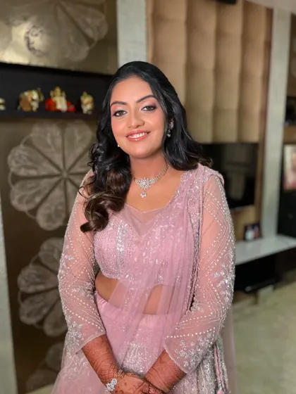 Pretty in pink for her engagement. This soft glam look features pink shimmery eyeshadow and rosy cheeks for a youthful, romantic glow.