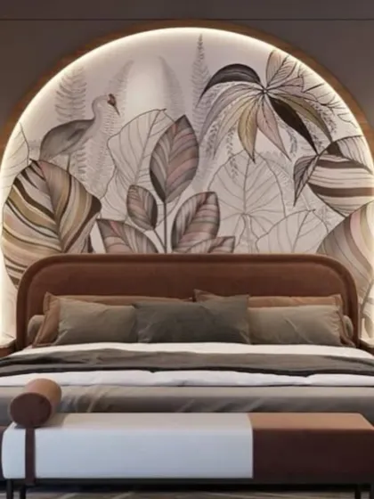 We created a bold, tropical-inspired focal point with a custom mural inside an arched headboard niche. The rich brown tones of the bed and bench ground the design, making it feel like a luxurious getaway.