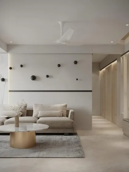 This living room design proves that minimalism can be warm and inviting. The neutral color palette is punctuated by unique, black spherical wall art, creating a space that is clean, modern, and full of personality.