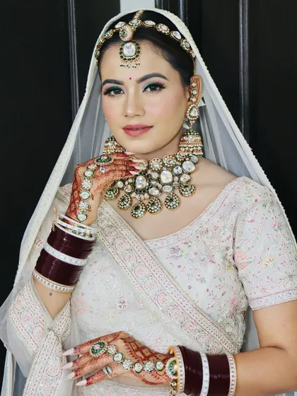 A confident pose from the bride. Her skin looks radiant and natural, which is my primary goal for every bridal makeup application.