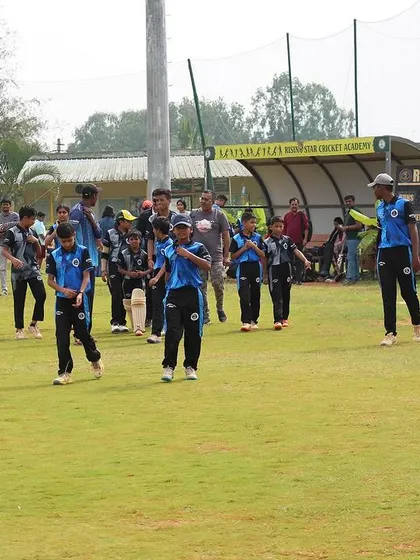 Players walking back to the pavilion after a game during the Dasara Cup.