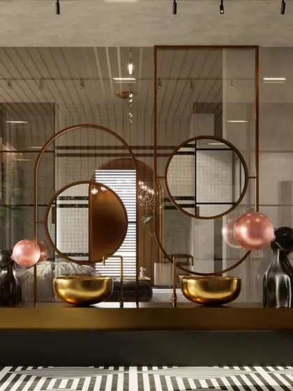 The vanity area in the same Kolkata master bathroom, designed with dual brass sinks and sculptural, layered mirrors that act as a functional art piece.