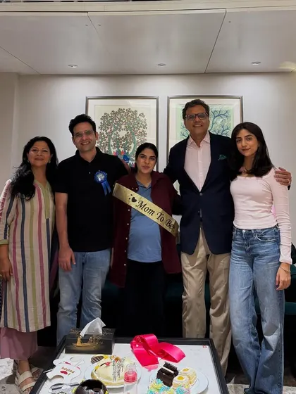 With my family and colleagues celebrating an upcoming arrival. I am a strong advocate for supporting women in the legal profession through all stages of life, including pregnancy.