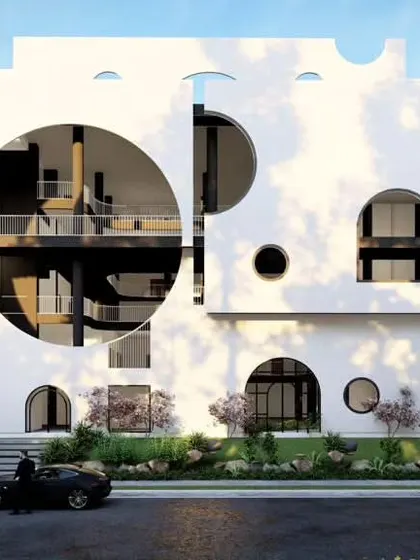 A concept design for a preschool featuring a playful facade with varied circular and arched openings. The non-imposing scale is intentionally designed to create a welcoming environment that eases the transition from home to school for young children.