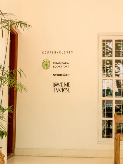 I’ve brought together some of my favorite local and conscious brands right here in the cafe. You can browse thoughtful reads from Champaca Bookstore, find sustainable fashion from No Nasties, or discover treasures at Love Me Twice thrift store. It’s all part of the experience.
