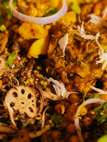 A macro shot of the 'Singju' and 'Bora' mixture, showing the details of the ingredients like lotus stem and fresh ginger.