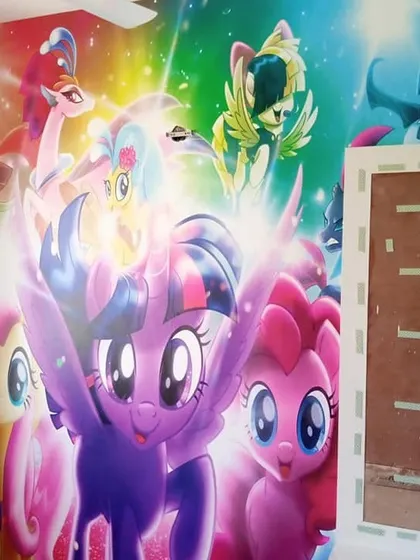 A vibrant and colorful 'My Little Pony' wall mural. We can bring any animated series to life on your child's walls, creating a bold and exciting room they'll love.