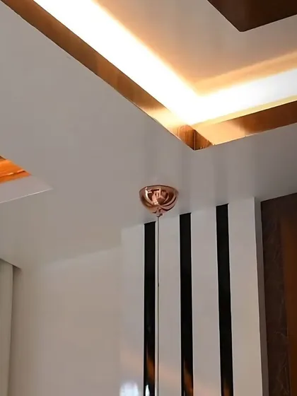 The elegant glow of automated cove lighting in a ceiling, adding a touch of sophistication and warmth to the room.