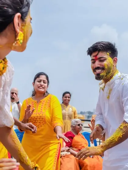 A candid shot of a couple dancing and having fun at their Haldi party. We capture the energy and movement of your celebration.