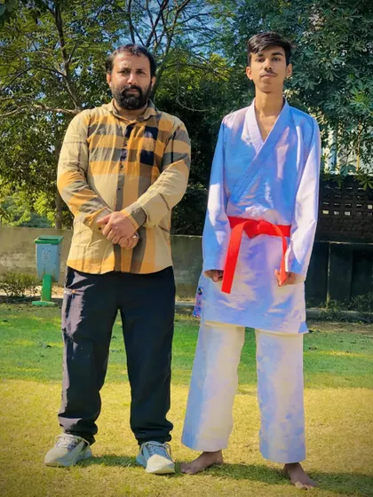 A senior student after successfully completing his red belt test. He is now one step closer to the coveted black belt.