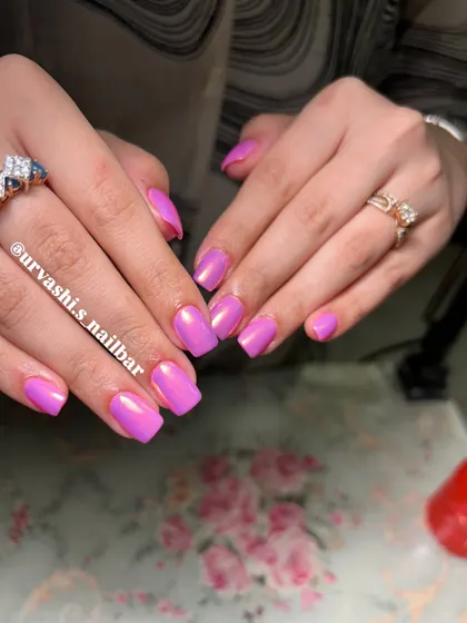 This is the ultimate Barbie look. A vibrant, glossy pink with a chrome finish that gives it an iridescent shine, perfect for anyone who loves a bold and feminine style.
