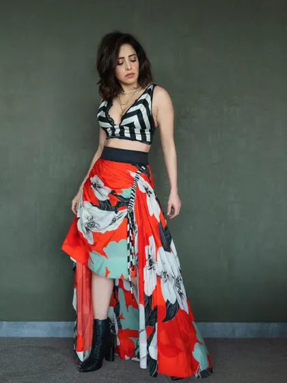The full view of this graphic-print skirt and striped top combo. It’s a perfect example of modern, edgy styling.