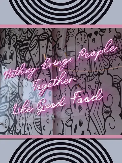 "Nothing brings people together like good food." This neon sign at our venue reflects our philosophy. We believe that great food is a key ingredient for a memorable party.