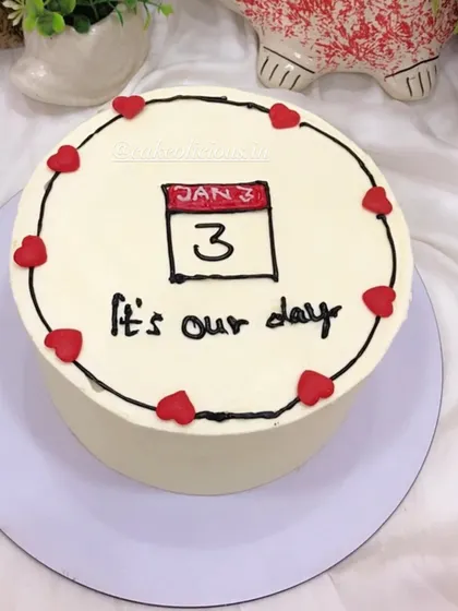 Another version of my popular calendar cake, this one for a 3rd of January anniversary. This cutesy design is a chocolate truffle cake finished with smooth white ganache.