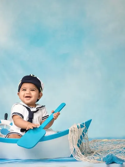 A happy sailor enjoying the sunshine on the water. The bright lighting and cheerful expression make this a standout shot from my nautical collection.