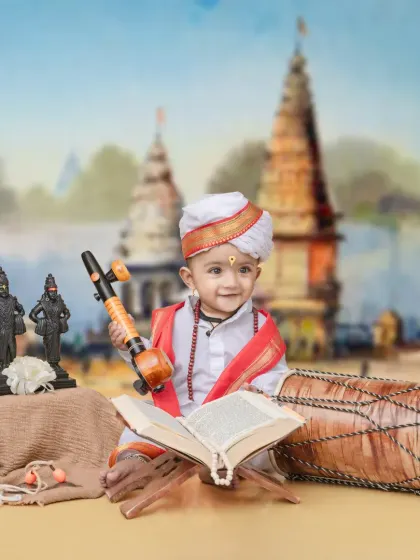 I honor our local Varkari heritage with this special theme. Your child will be dressed in traditional white robes, holding a veena, with a backdrop of Pandharpur, creating a timeless memory of devotion.