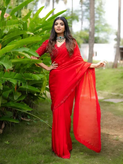 Another full-length shot, this time with the bride posing confidently. This image showcases the entire ensemble from head to toe.