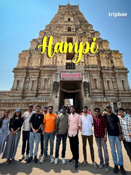 A great group photo in front of the towering gopuram of the Virupaksha Temple in Hampi.