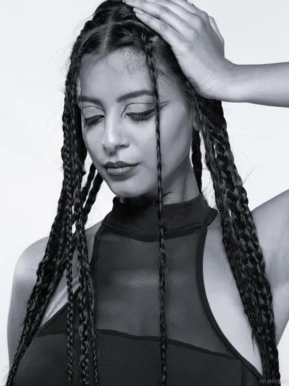 A soft and serene black and white portrait from the braids series.