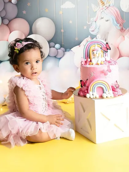 A magical unicorn and rainbow theme for this little one's birthday. The pastel colors and dreamy setup, complete with a custom cake, make for a fairytale celebration.