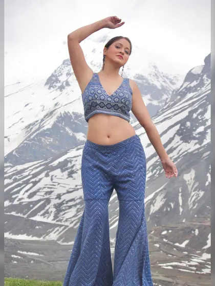 A dynamic pose showing the full outfit and its flattering silhouette.
