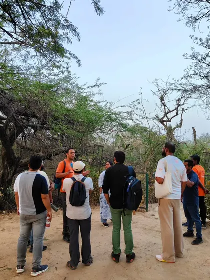 Another moment of storytelling amidst the greenery of the Northern Ridge, where our guide brings the area's history to life for an attentive group.