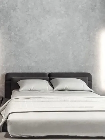 Sleek vertical wall sconces provide a clean, minimalist lighting solution for modern bedrooms. Placed on either side of the bed, they offer excellent reading light while maintaining an uncluttered and sophisticated aesthetic.