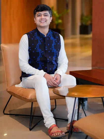 A relaxed portrait. My work involves understanding people's energy, and for that, I practice Nadi Parikshan (pulse diagnosis) to gain deeper insights.