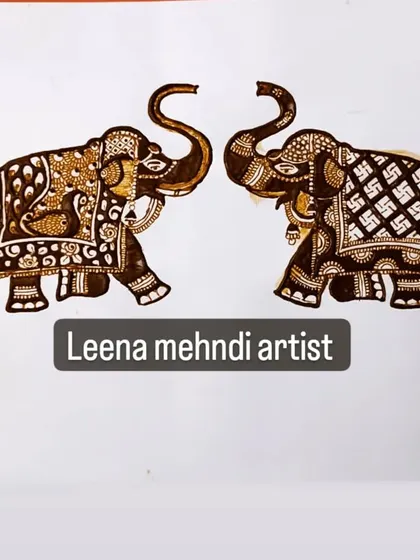 A pair of royal elephants with different intricate patterns on their backs. This shows how you can vary a single motif to create interest in a design.